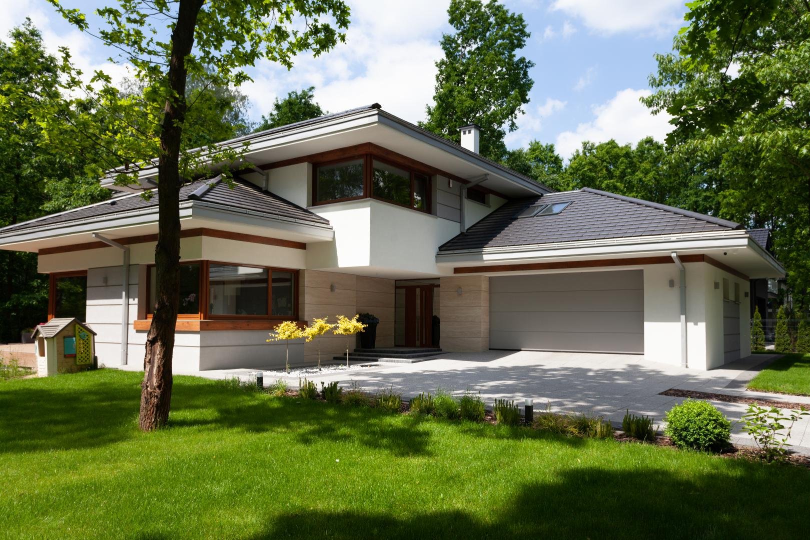 New-House - Projekty domów z poddaszem użytkowym i garażem – najlepsze propozycje